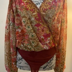 Blouse / bodysuit with lining and front snap closure.